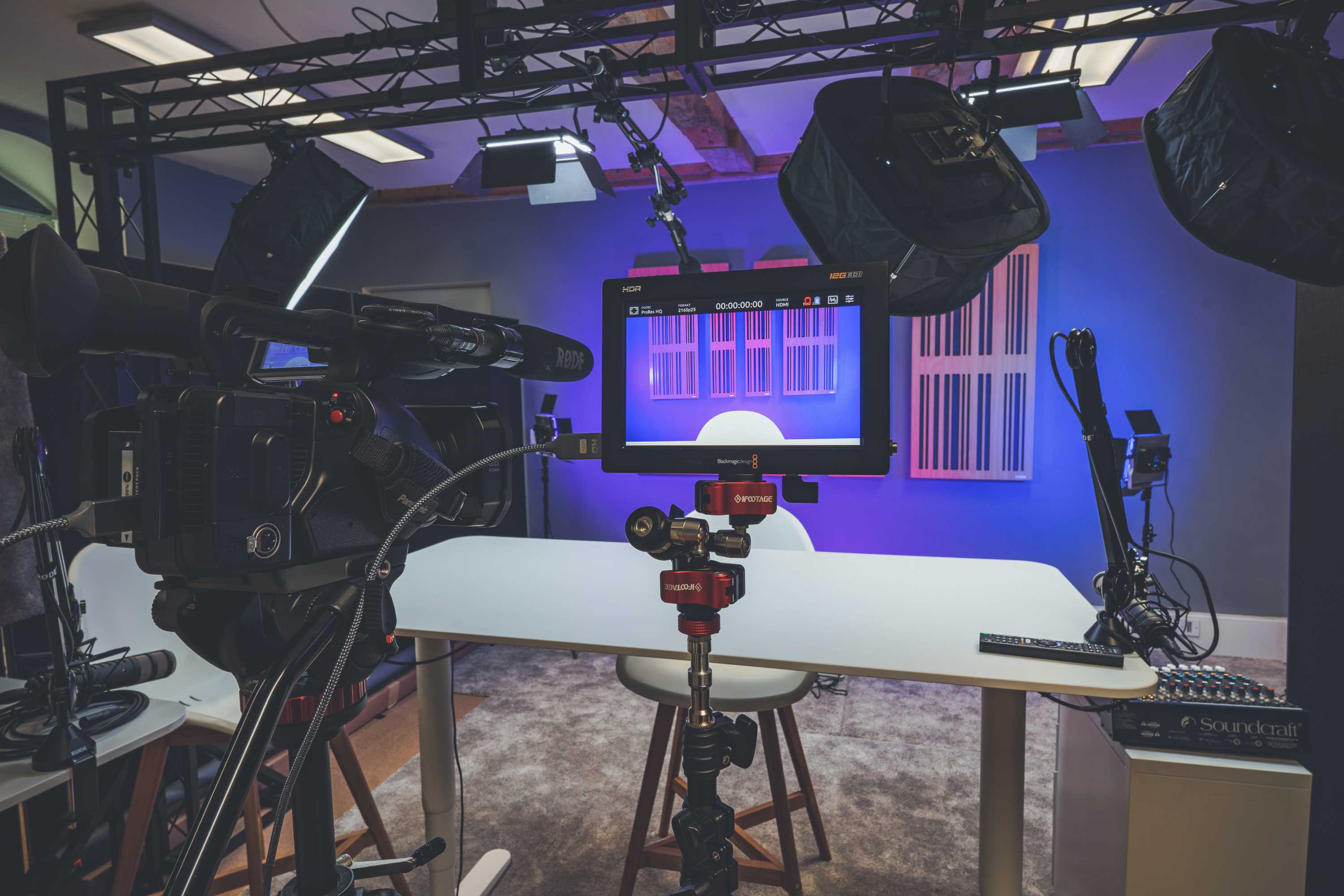 A fully equipped, modern video recording and animation studio with cameras, monitors, sound and light equipment.