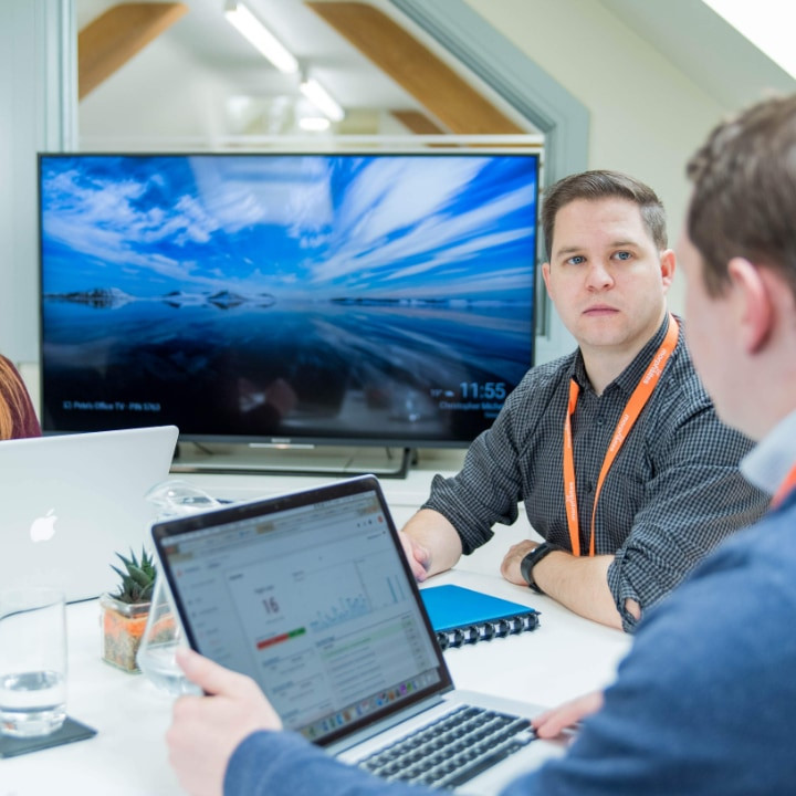 People conversing around a table